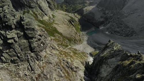 Drone Flying Over High Cliffs and Lakes in the Valley