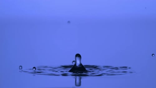Water Drop Splash on Blue Surface