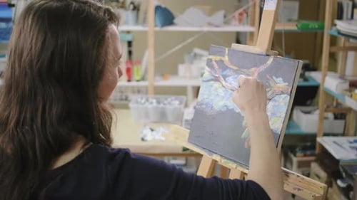 Woman Is Painting Picture By Oil Artistic Paints on Master Class of Art Therapy