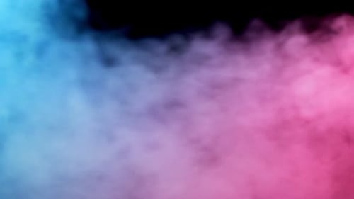 Colorful Smoke Billows Against Black Background