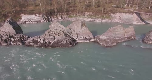 Low Altitude Flight Over Fresh Fast Mountain River with Rocks at Sunny Summer Morning