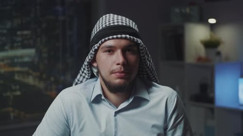 Close Up of Arabic Young Man with Kandora Speaking to the Camera