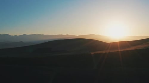 Aerial View of Rolling Hills at Sunrise