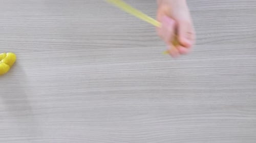 Hand Playing with Textured Slime with Bubbles Stretching the Gooey Substance