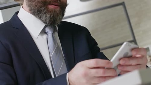 Man in Suit Handshake, Cell Phone Call in Office