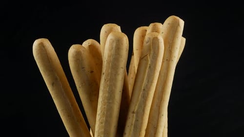 grissini close up on black background