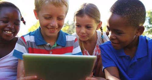Group of kids using digital tablet