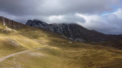 Drone View of Mountain Rock Covered with Grey Cloud