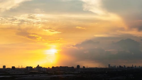 Golden Sunrise Behind City Skyline Timelapse