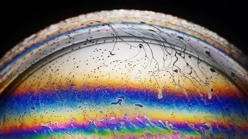 Rainbow Soap Bubble with Flowing Dark Lines