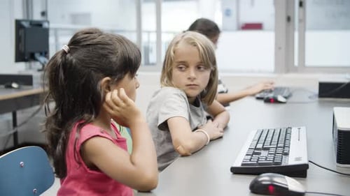 Children Studying Computers in Brightly Lit Classroom
