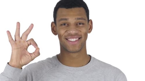 Young Adult Making OK Hand Gesture