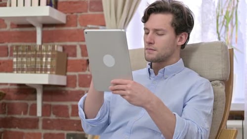 Young Man Get Disappointed on Tablet