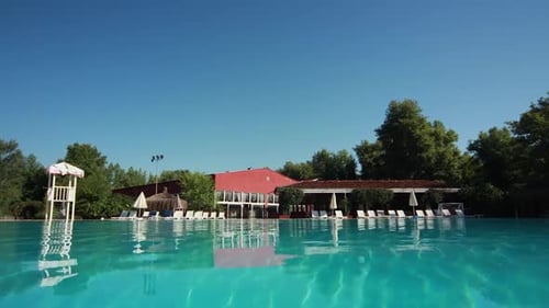 Clear Swimming Pool at Tropical Resort on Sunny Day