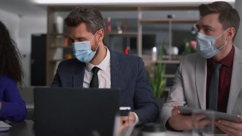 Diverse Business Team Brainstorm Together Wearing Protective Face Mask in Office