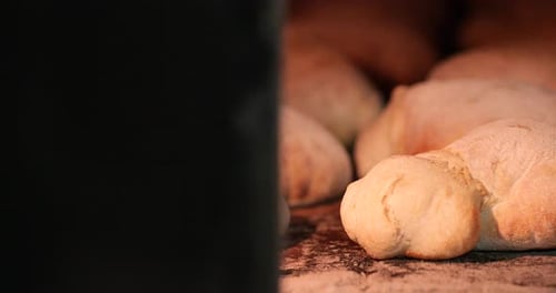 Bakery - Sourdough Bread Baked Inside The Hot Oven. - close up, sliding shot