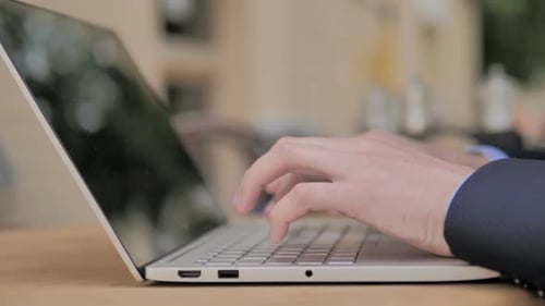 Typing on Laptop in Corporate Environment
