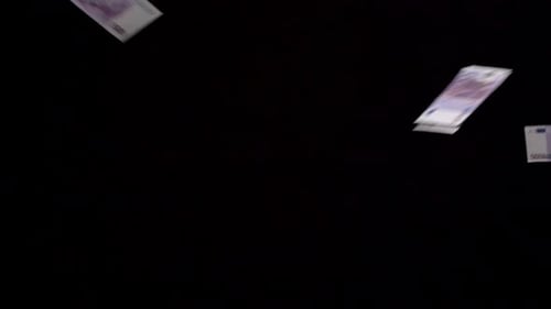 Euro Banknotes Falling on Black Background