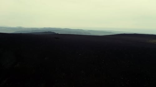 Panoramic View Of Rugged Landscape Under White Cloudy Sky. aerial