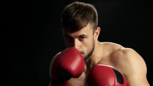 Close Up Young Boxer Is Training