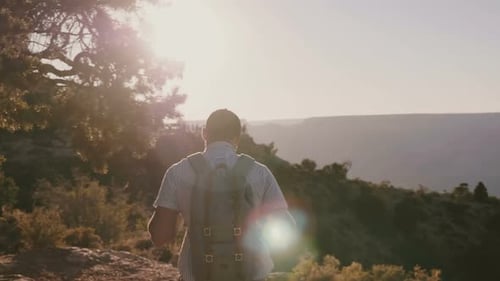 Man Hiking at Grand Canyon at Sunset