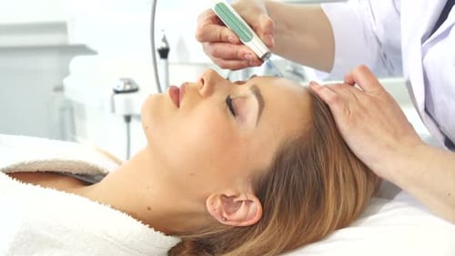 Woman Receiving Facial Treatment at Medical Spa