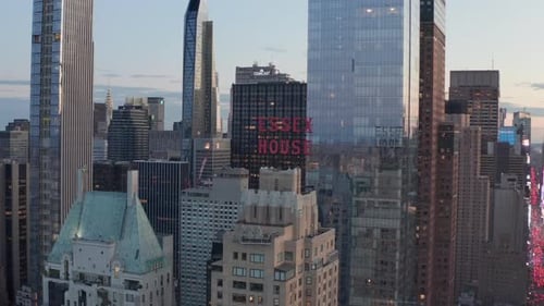 AERIAL: Close Up of Essex House Manhattan Skyline at Wonderful Sunset with Flashing City Lights in