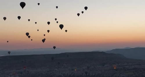 Aerial Cinematic Drone View of Colorful Hot Air Balloon Flying Over Cappadocia