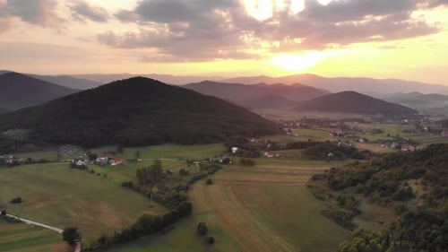 Sunrise Over Rolling Hills and Rural Landscape