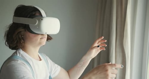 Woman Immersed in Virtual Reality Headset Indoors