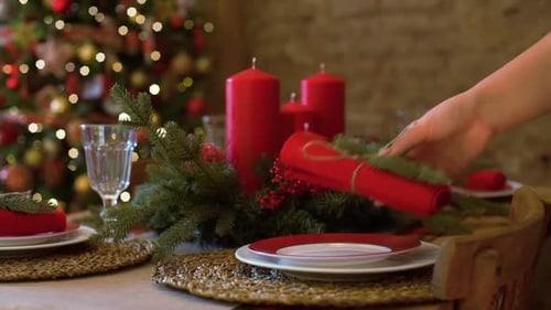 Setting Festive Christmas Table with Decorations