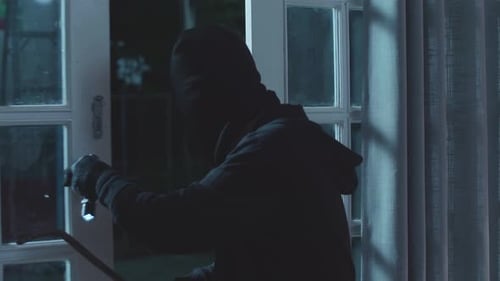 Masked Man Breaking Into House at Night