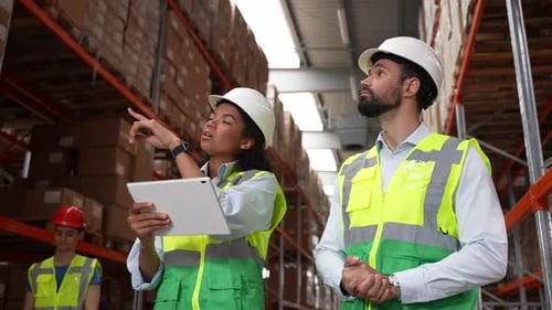 Storehouse Employees Taking Inventory of Goods