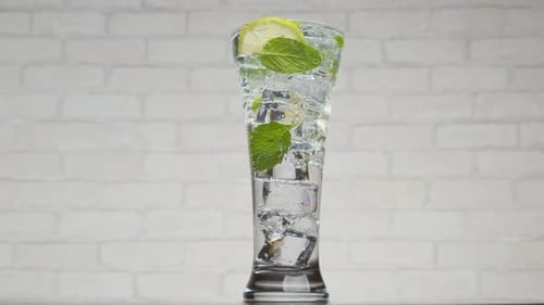 Tall Refreshing Glass of Ice Water with Lime