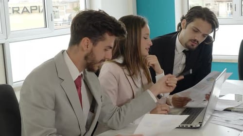 business, work-young managers work together on the powerpoint presentation