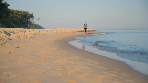 Woman Runs on Sea Beach