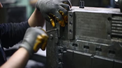 The Man Tightening A Screw With Allen