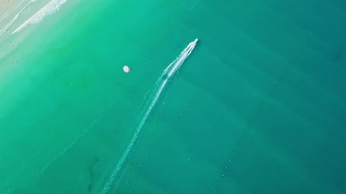 Tourists Parasailing Over Sea Coastline, Drone Point View.