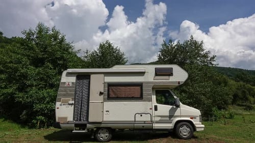 Recreational Vehicle Parked in Nature on Sunny Day