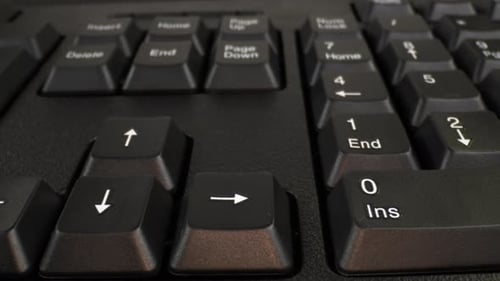 Close Up of Computer Keyboard and Arrow Keys