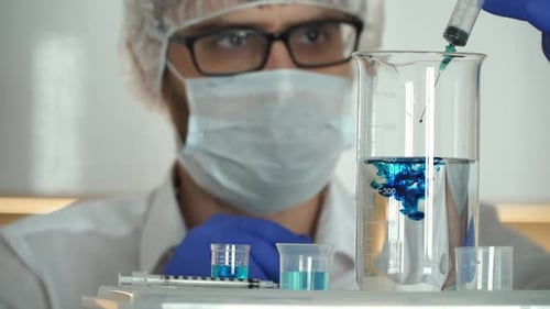 Liquid Mixing in Beaker with Syringe in Lab