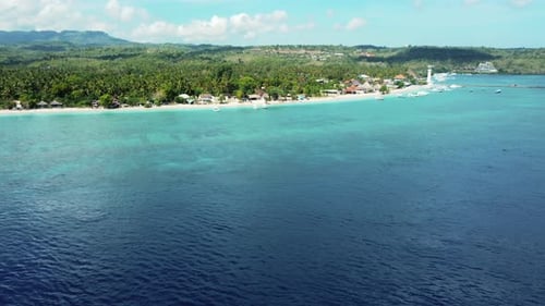 Fly along white sand beach small tropical island