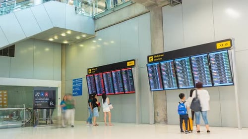 Busy Airport Terminal Time Lapse with Travelers