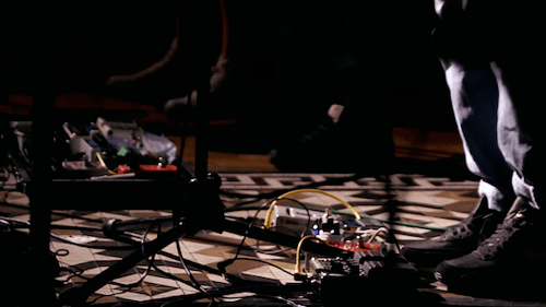 Musician Performing Live with Synthesizer on Stage