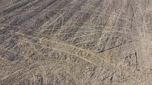 Desert Ground with Tracks Aerial Shot