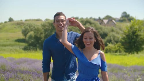 Couple Walking and Twirling in Lavender Field