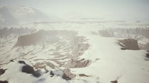 Snowcovered Rocks on a Windy Plateau