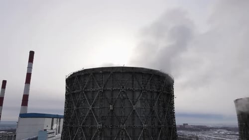the Cooling Tower Releases a Cloud of Steam Into the Atmosphere