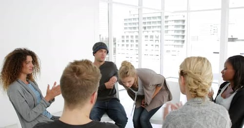 Group Therapy Session in Bright Workplace Meeting Room