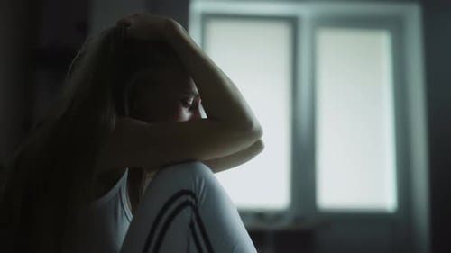 Upset Woman Cries Indoors in Close Up Shot